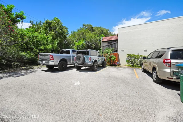 a view of car parked in front of a house