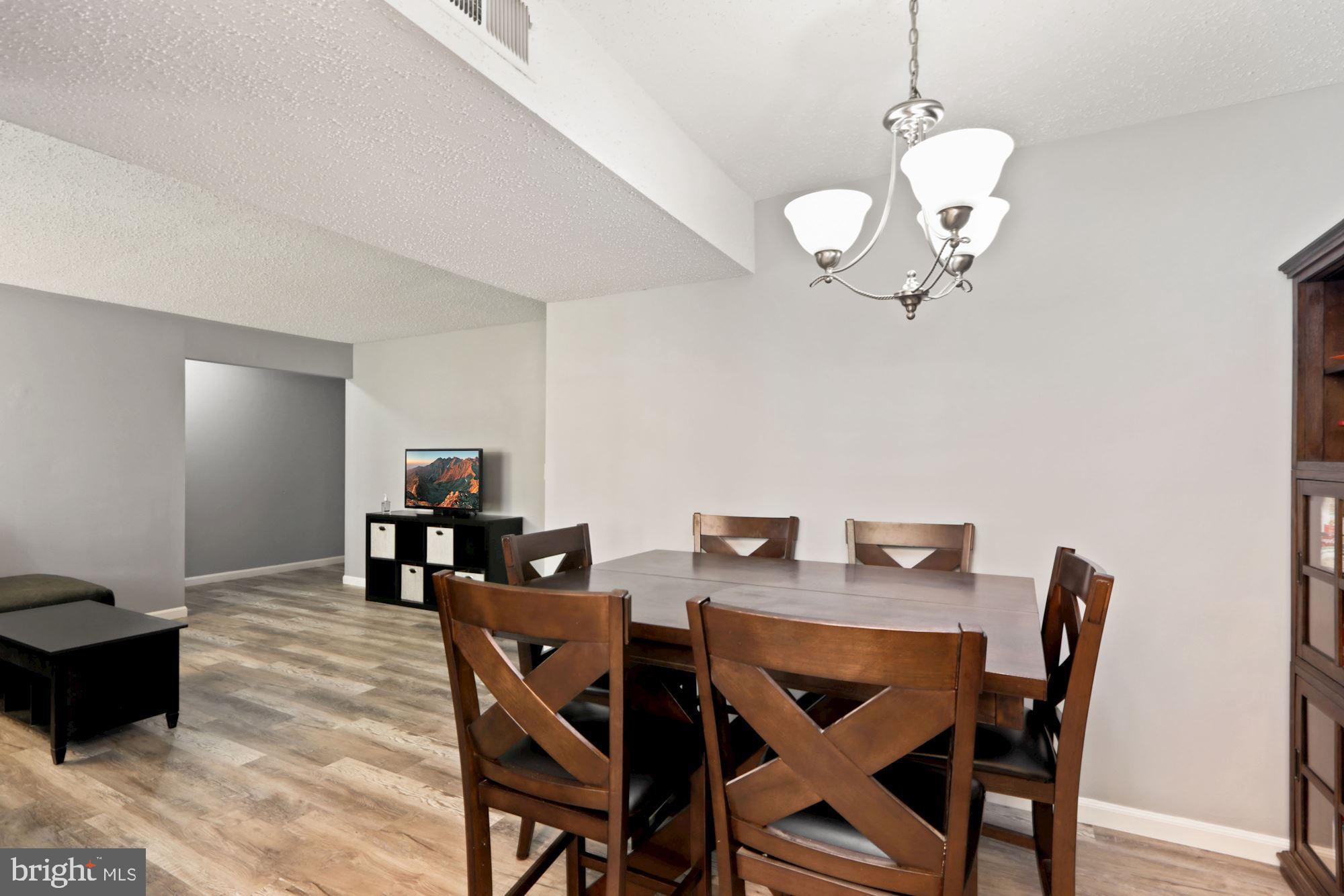 110 Fort Evans Road Southeast, Unit A Leesburg, VA 20175 - Photo 10 of 34 Dining area open to living space