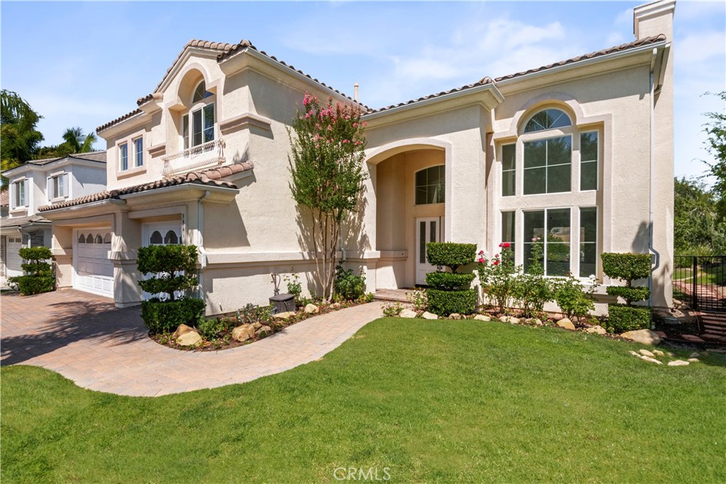 front view of a house with a garden
