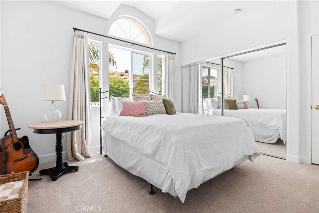 3966 Leighton Point Road Calabasas, CA 91301 - Photo 18 of 37 a bedroom with a bed and a mirror