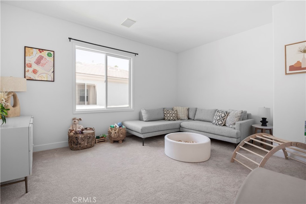 3966 Leighton Point Road Calabasas, CA 91301 - Photo 19 of 37 a living room with furniture a couch and a window