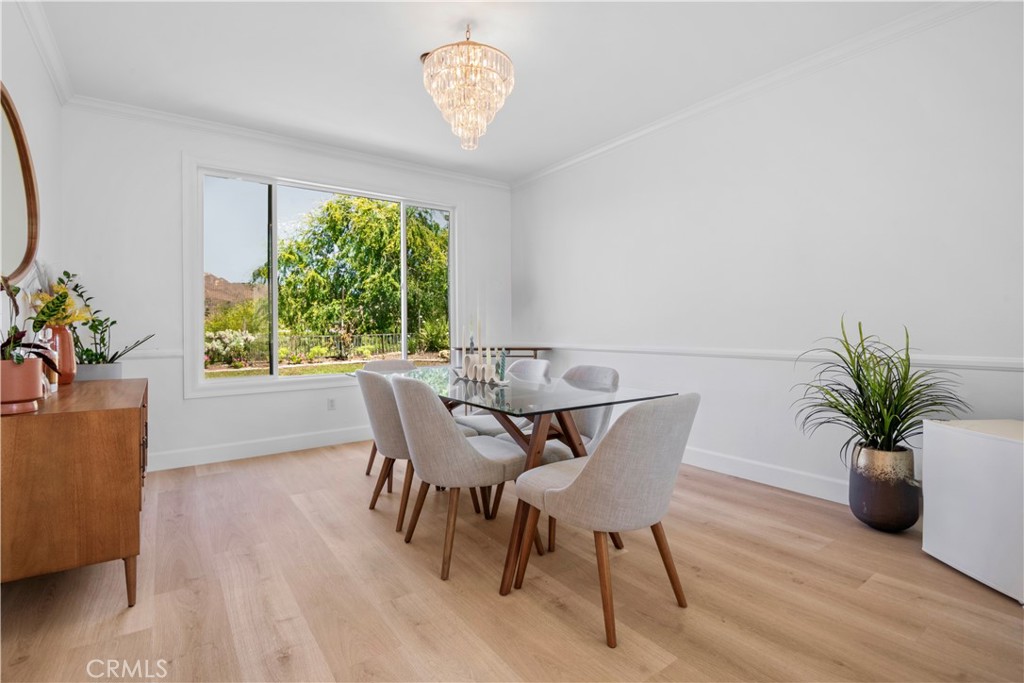 3966 Leighton Point Road Calabasas, CA 91301 - Photo 5 of 37 a view of a dining room with furniture window and wooden floor