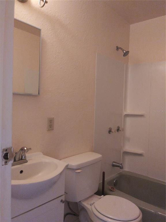 2008 Northwest 14th Street Ocala, FL 34475 - Photo 18 of 18 a white toilet sitting next to a bathroom sink
