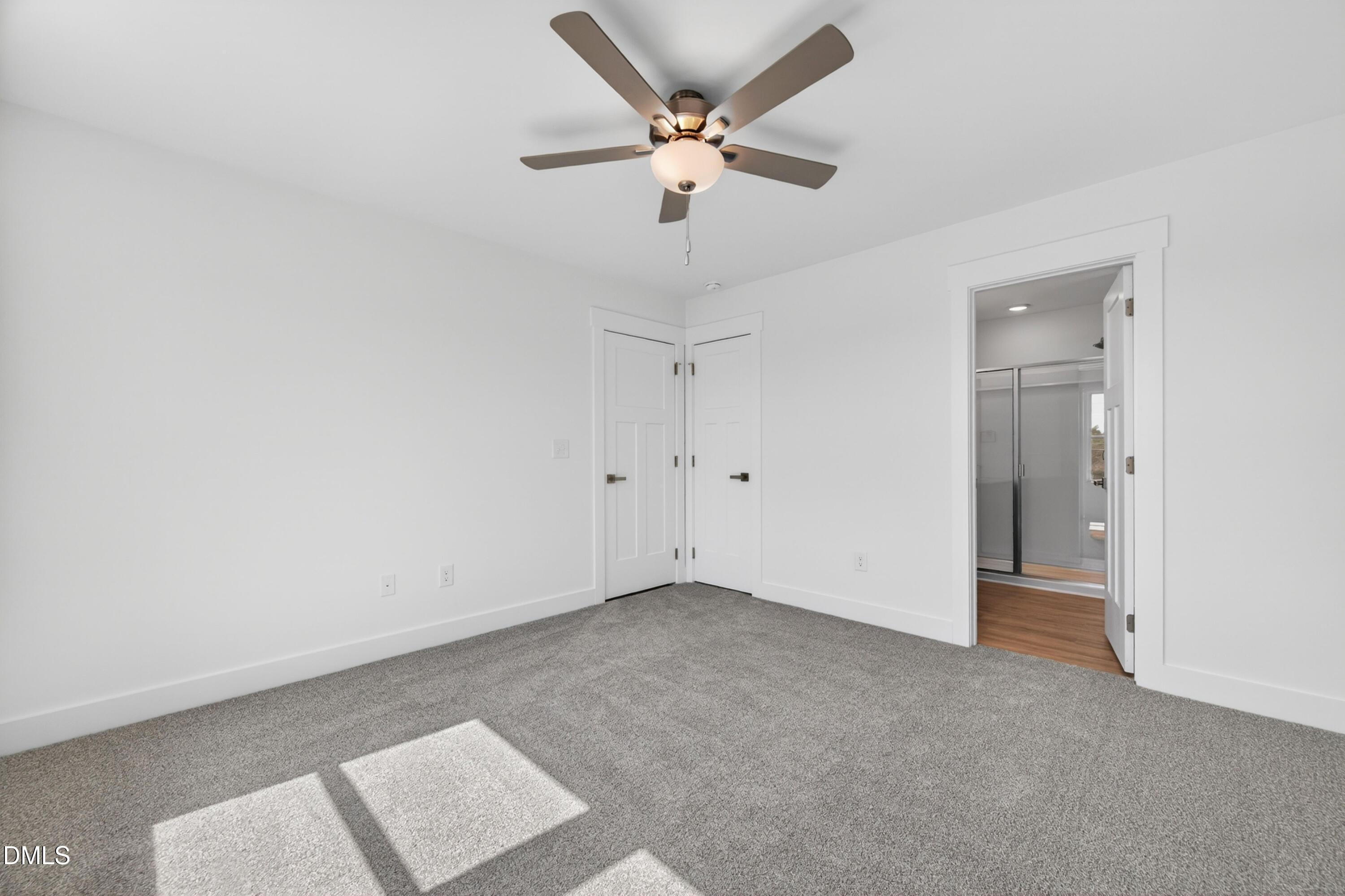 1238 Hurdle Mills Road Roxboro, NC 27573 - Photo 37 of 50 an empty room with a ceiling fan and a window