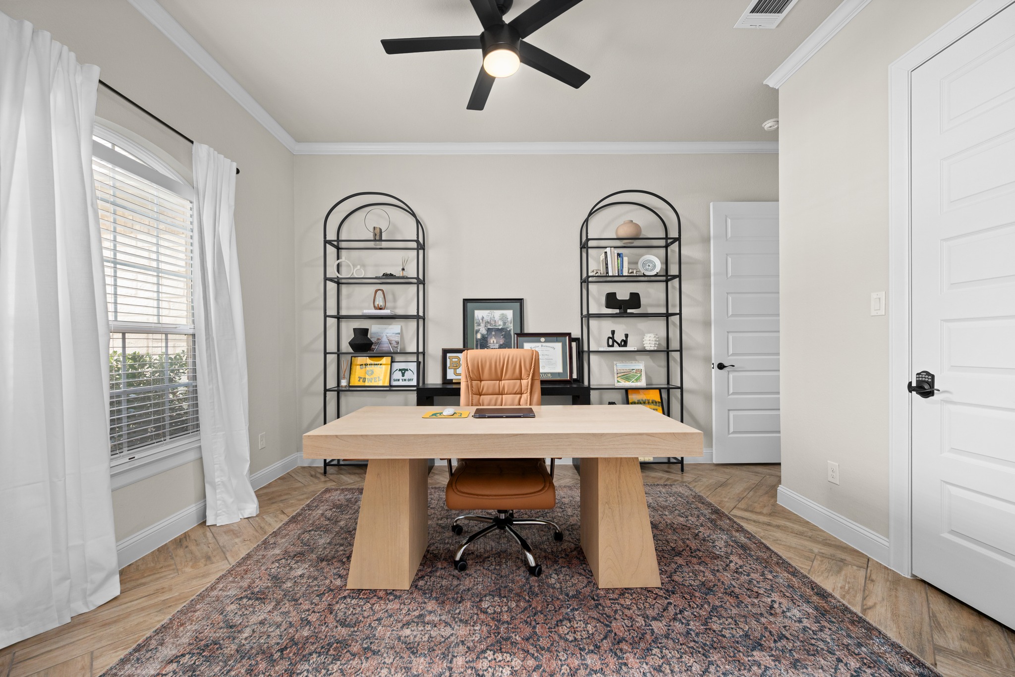 2100 Highland Ridge Road Georgetown, TX 78628 - Photo 16 of 30 A refined home office with a modern desk and twin open shelving units, ideal for focused productivity.