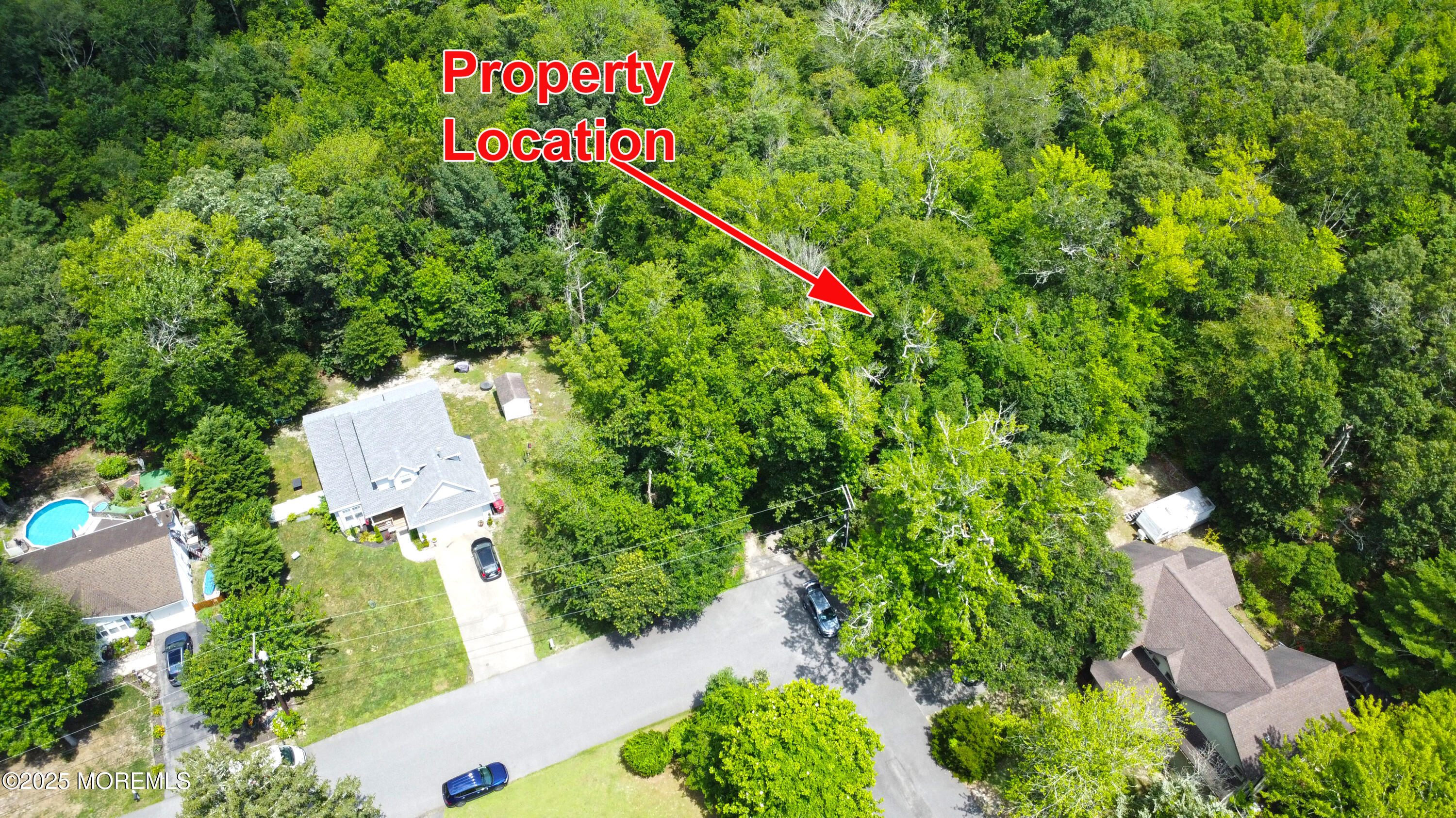 0 Red Bank Avenue Bayville, NJ 08721 - Photo 2 of 7 an aerial view of a residential apartment building with a yard and street