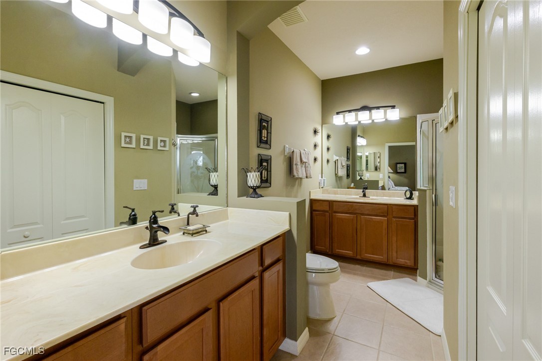 3610 Rue Alec Loop, Unit 1 North Fort Myers, FL 33917 - Photo 24 of 39 a bathroom with a sink double vanity and a mirror