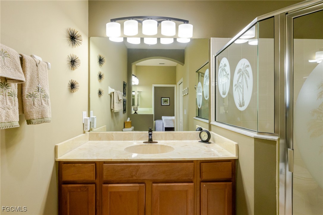 3610 Rue Alec Loop, Unit 1 North Fort Myers, FL 33917 - Photo 26 of 39 a bathroom with a sink and a mirror