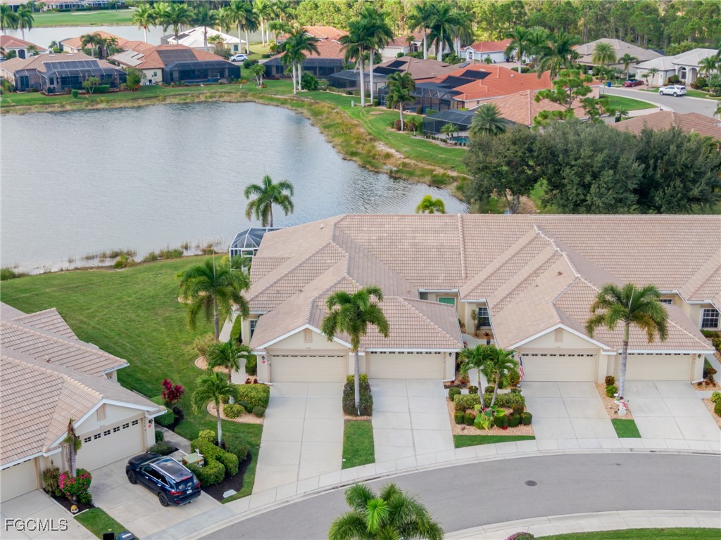 3610 Rue Alec Loop, Unit 1 North Fort Myers, FL 33917 - Photo 33 of 39 an aerial view of a house with a garden and lake view