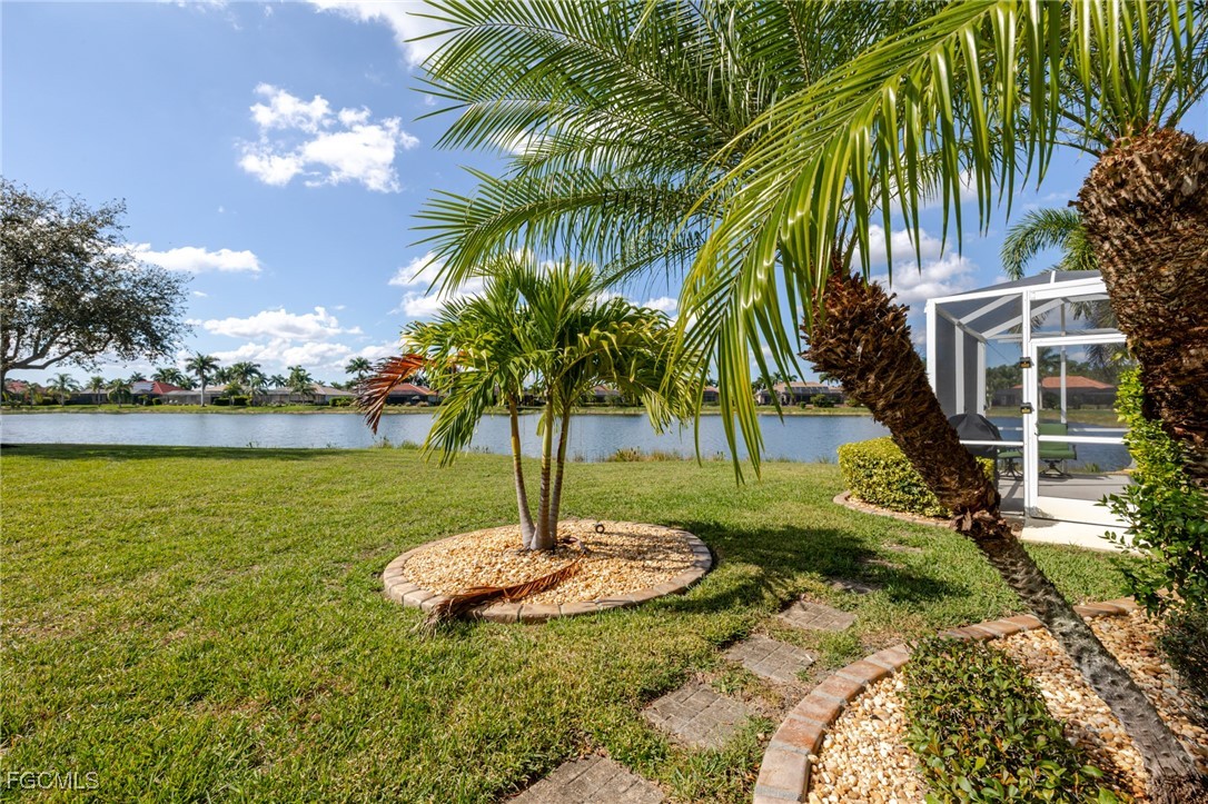 3610 Rue Alec Loop, Unit 1 North Fort Myers, FL 33917 - Photo 39 of 39 a swimming pool with lots of palm trees