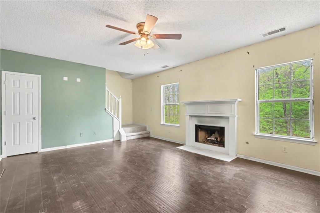 3111 Mineral Ridge Lane Stone Mountain, GA 30087 - Photo 2 of 5 a view of an empty room with window and fire place