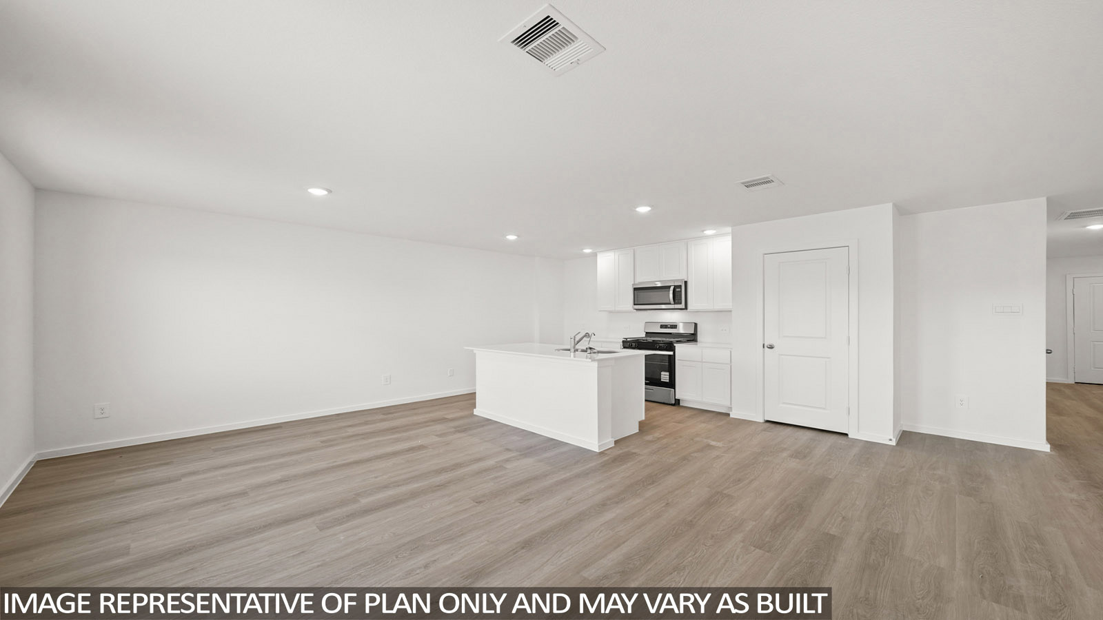 156 Baby Calf Roping Road Jarrell, TX 76537 - Photo 7 of 22 An open concept living area features resilient plank flooring and a sleek kitchen with an island.