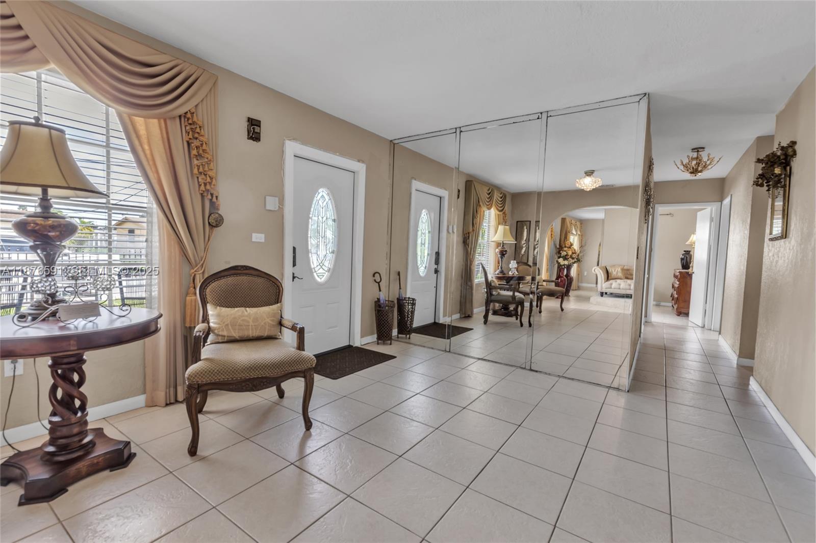22270 Southwest 109th Avenue Miami, FL 33176 - Photo 12 of 48 a living room with furniture a dining table and chairs