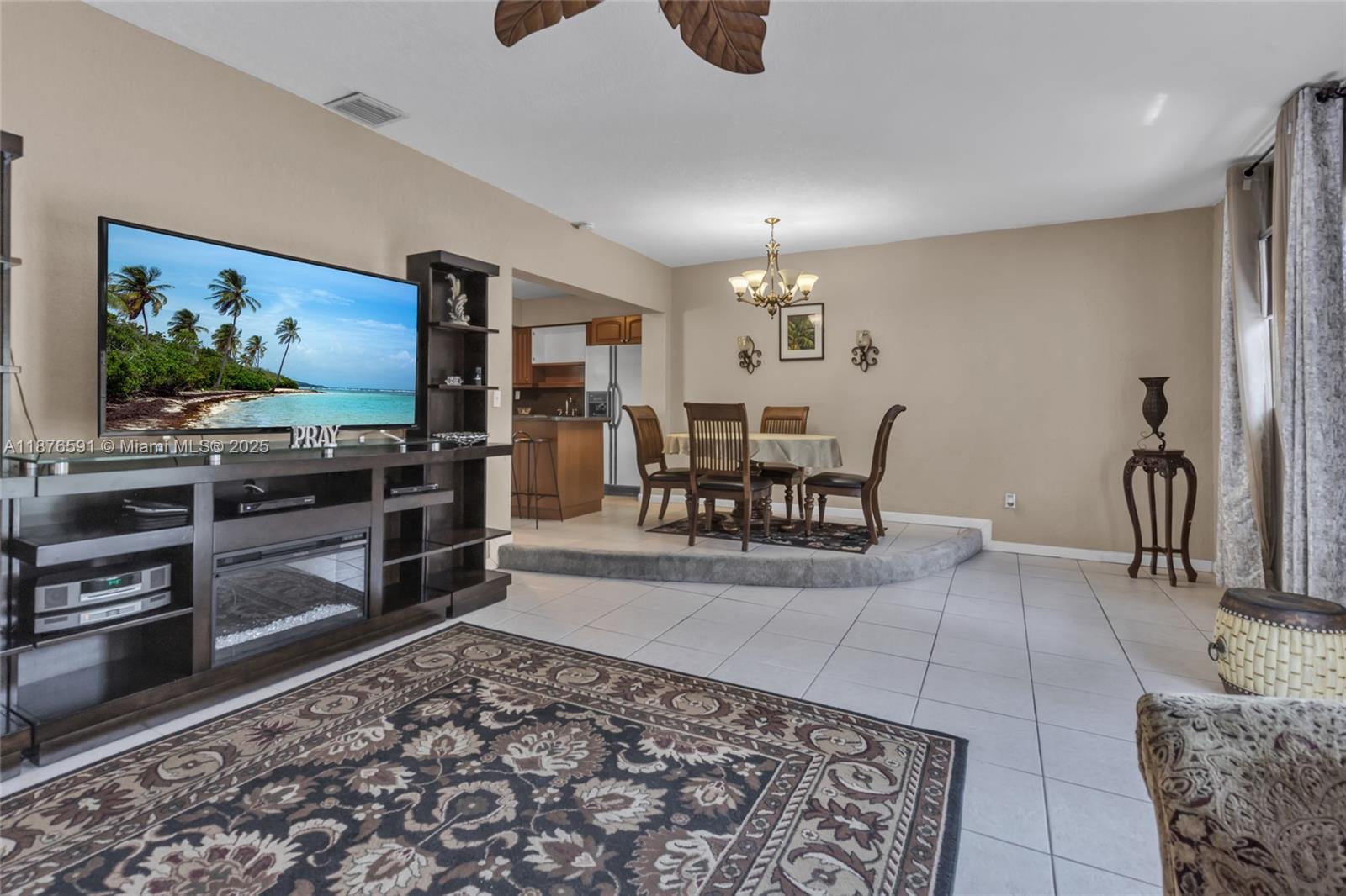 22270 Southwest 109th Avenue Miami, FL 33176 - Photo 18 of 48 a living room with furniture and a flat screen tv