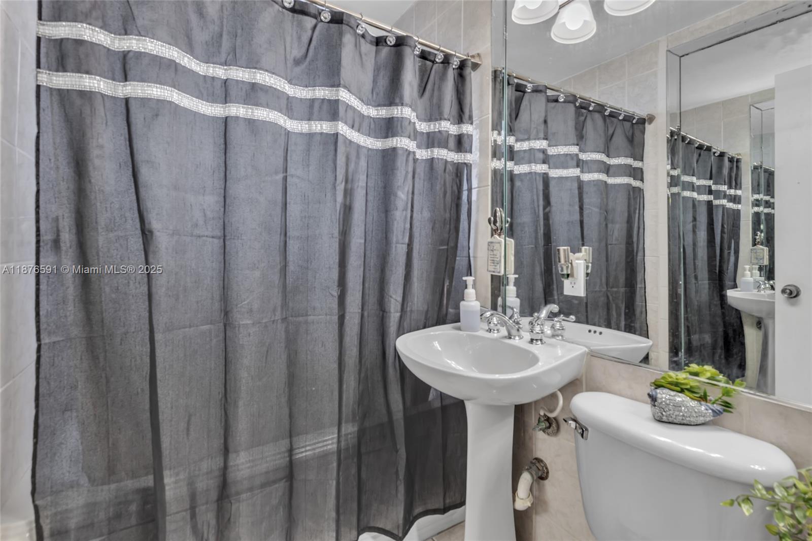 22270 Southwest 109th Avenue Miami, FL 33176 - Photo 19 of 48 a bathroom with a sink a toilet and shower