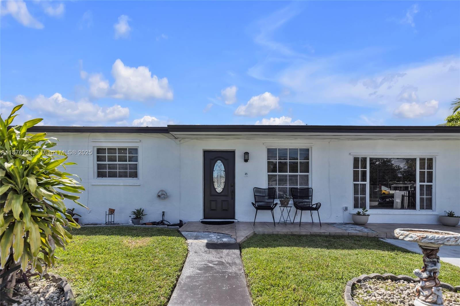 22270 Southwest 109th Avenue Miami, FL 33176 - Photo 2 of 48 a view of a house with swimming pool and sitting area