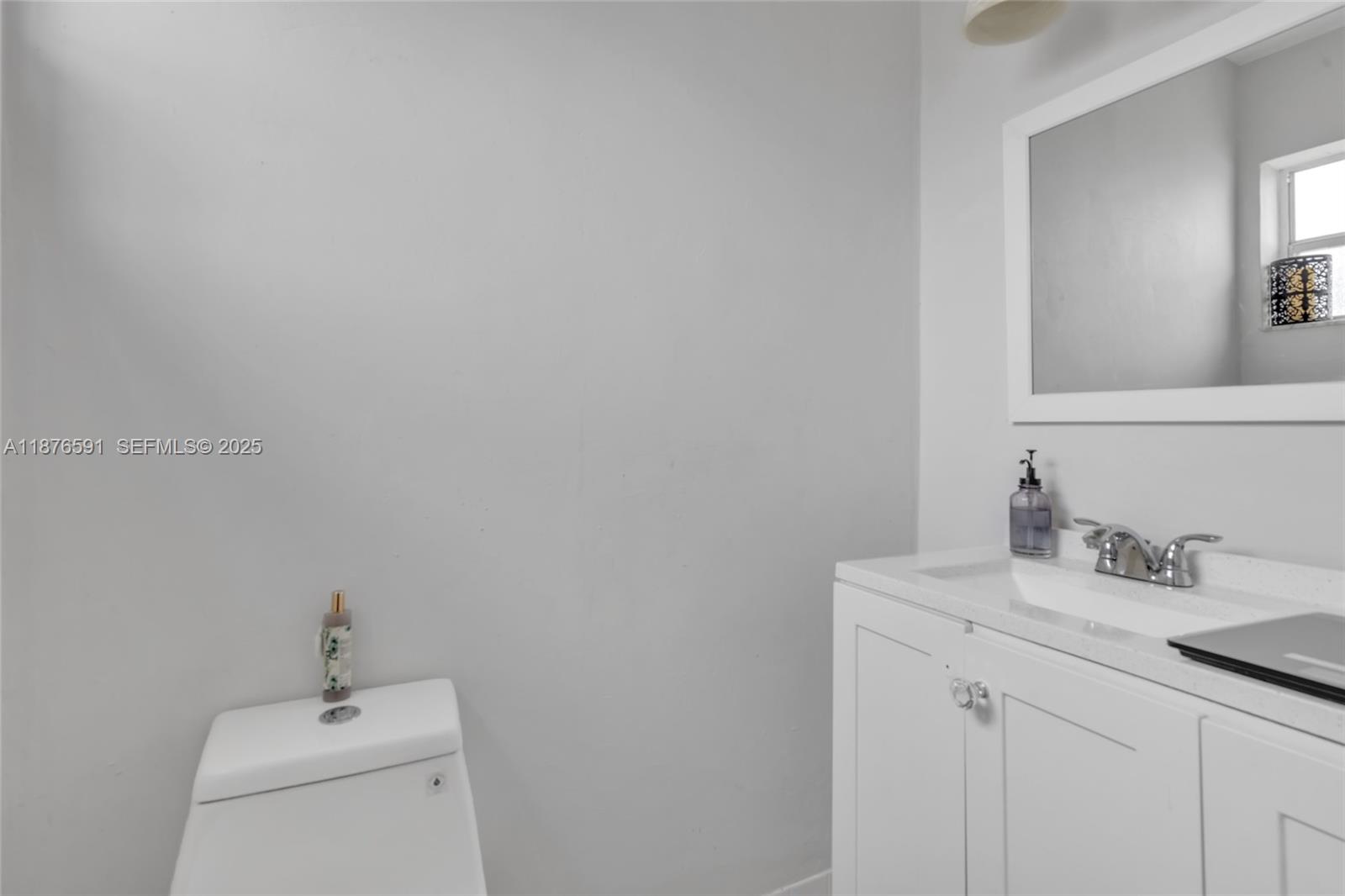 22270 Southwest 109th Avenue Miami, FL 33176 - Photo 22 of 48 a bathroom with a sink a vanity and a mirror