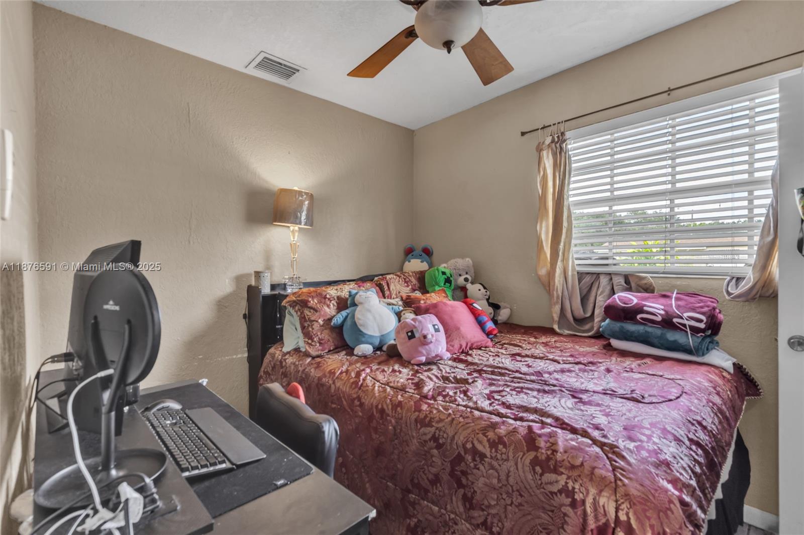 22270 Southwest 109th Avenue Miami, FL 33176 - Photo 27 of 48 a bedroom with a bed window and couch