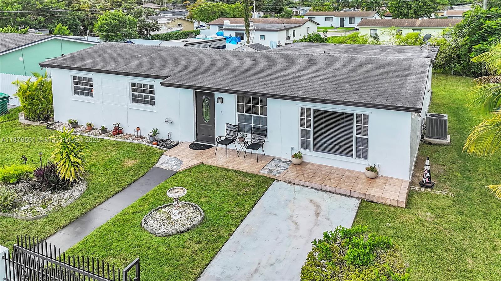 22270 Southwest 109th Avenue Miami, FL 33176 - Photo 30 of 48 a house view with a garden space