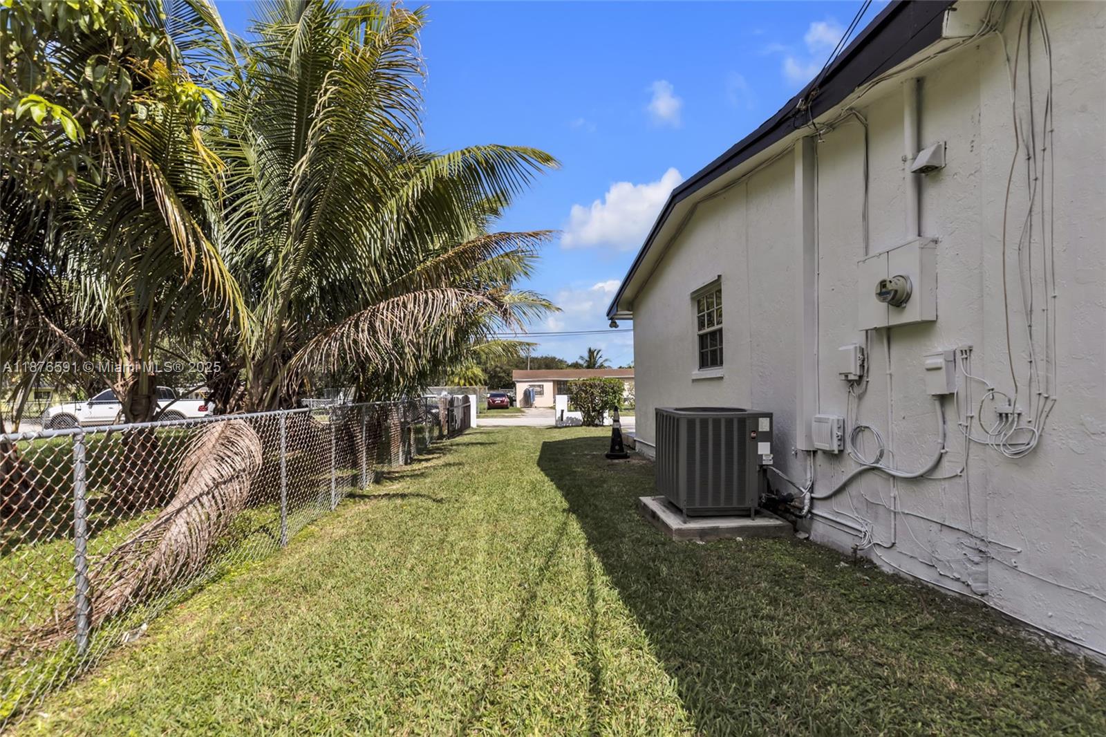 22270 Southwest 109th Avenue Miami, FL 33176 - Photo 39 of 48 a view of a house with a yard