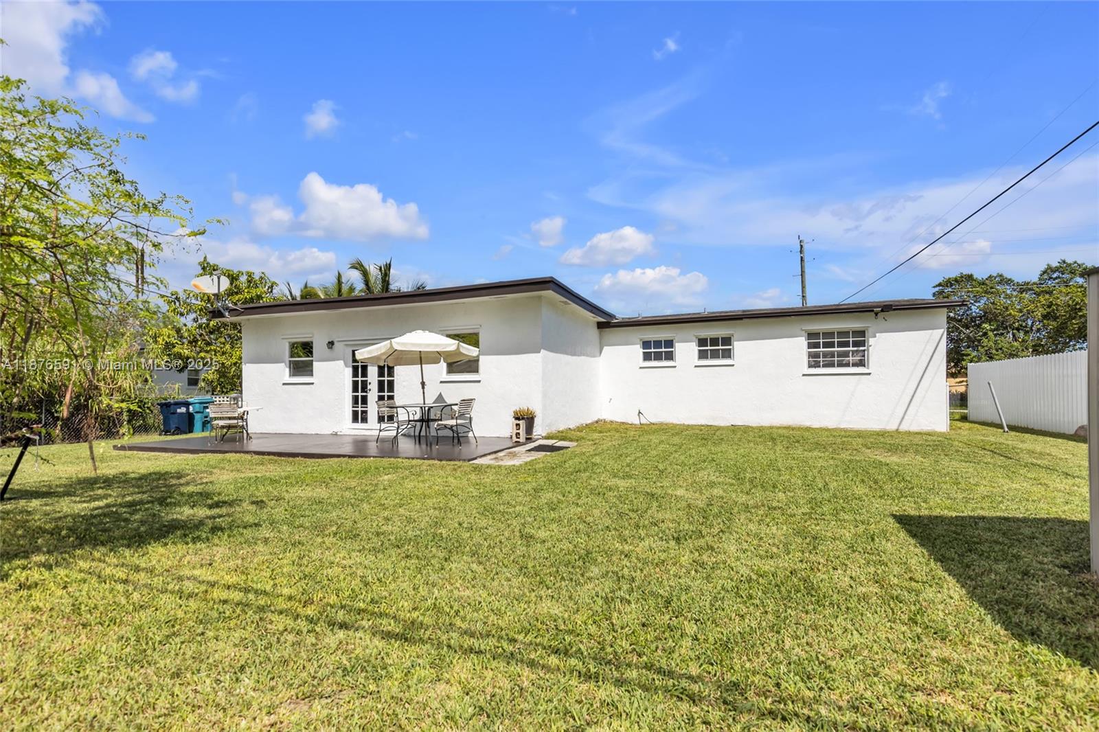 22270 Southwest 109th Avenue Miami, FL 33176 - Photo 42 of 48 a view of a house with a yard