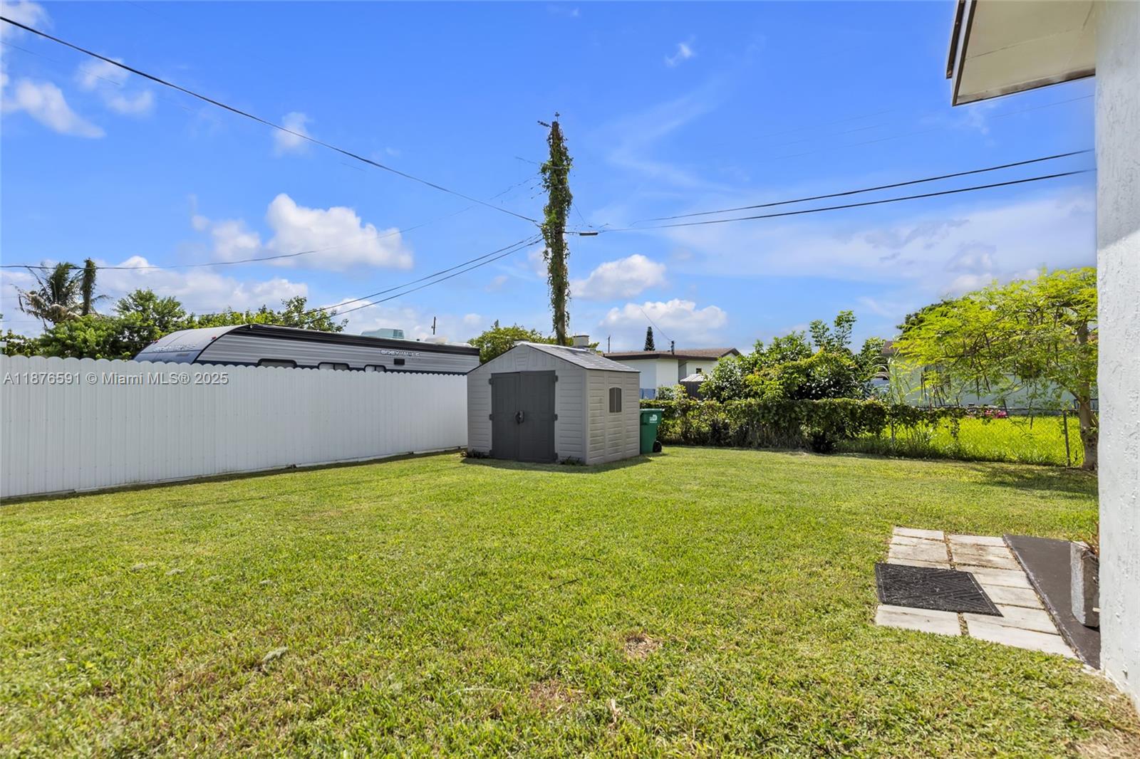 22270 Southwest 109th Avenue Miami, FL 33176 - Photo 44 of 48 a house view with a garden space