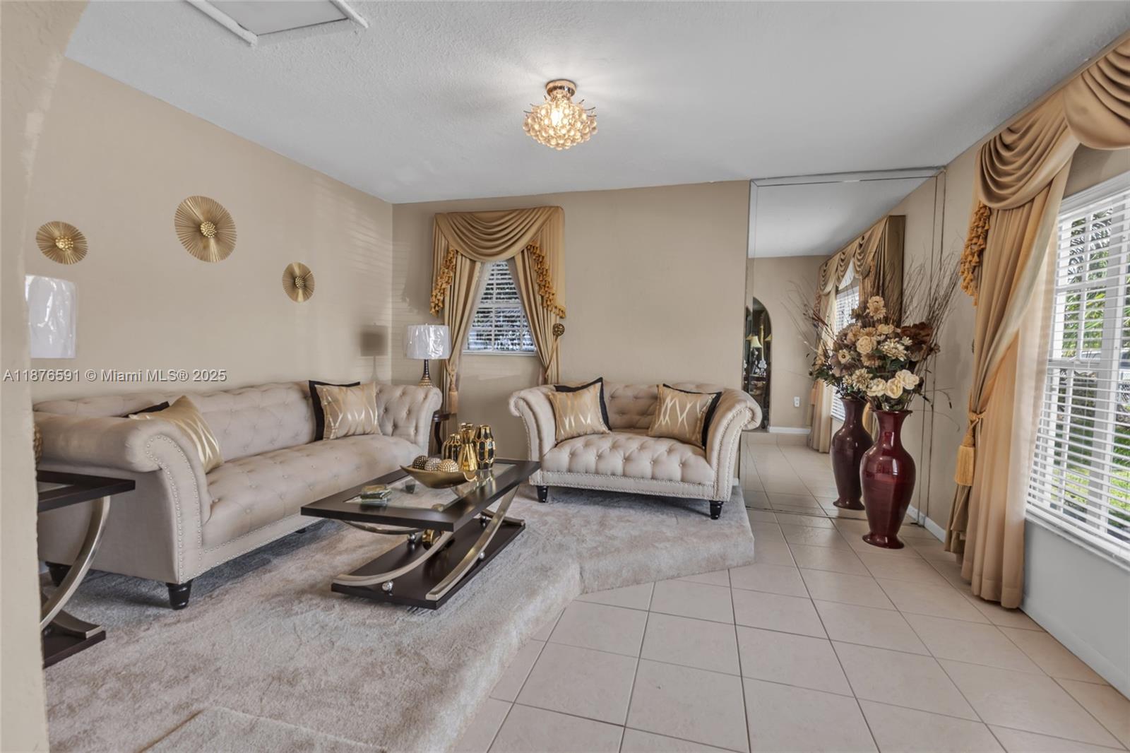 22270 Southwest 109th Avenue Miami, FL 33176 - Photo 6 of 48 a living room with furniture and a potted plant
