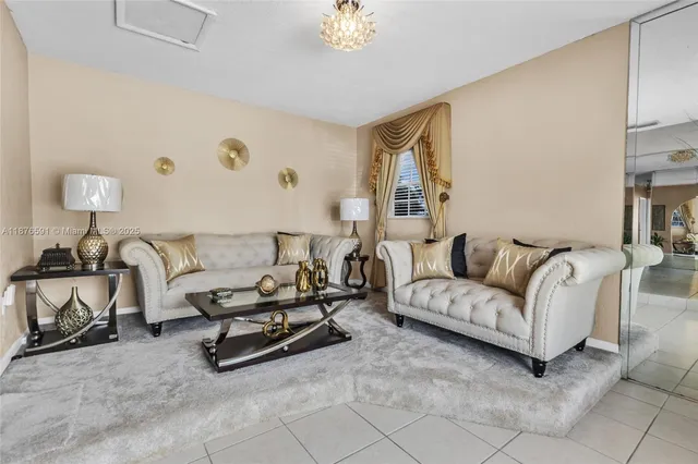 a living room with furniture and a lamp