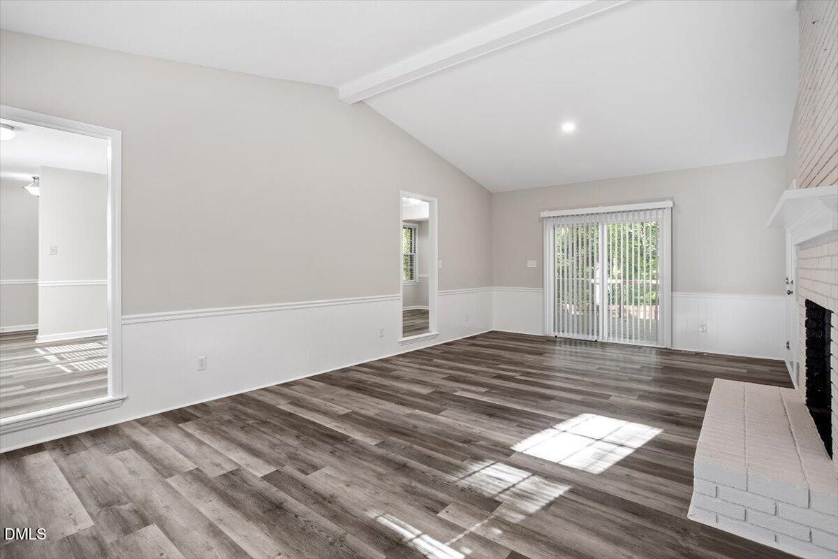 8233 Clear Brook Drive Raleigh, NC 27615 - Photo 14 of 28 a view of empty room with wooden floor and fan