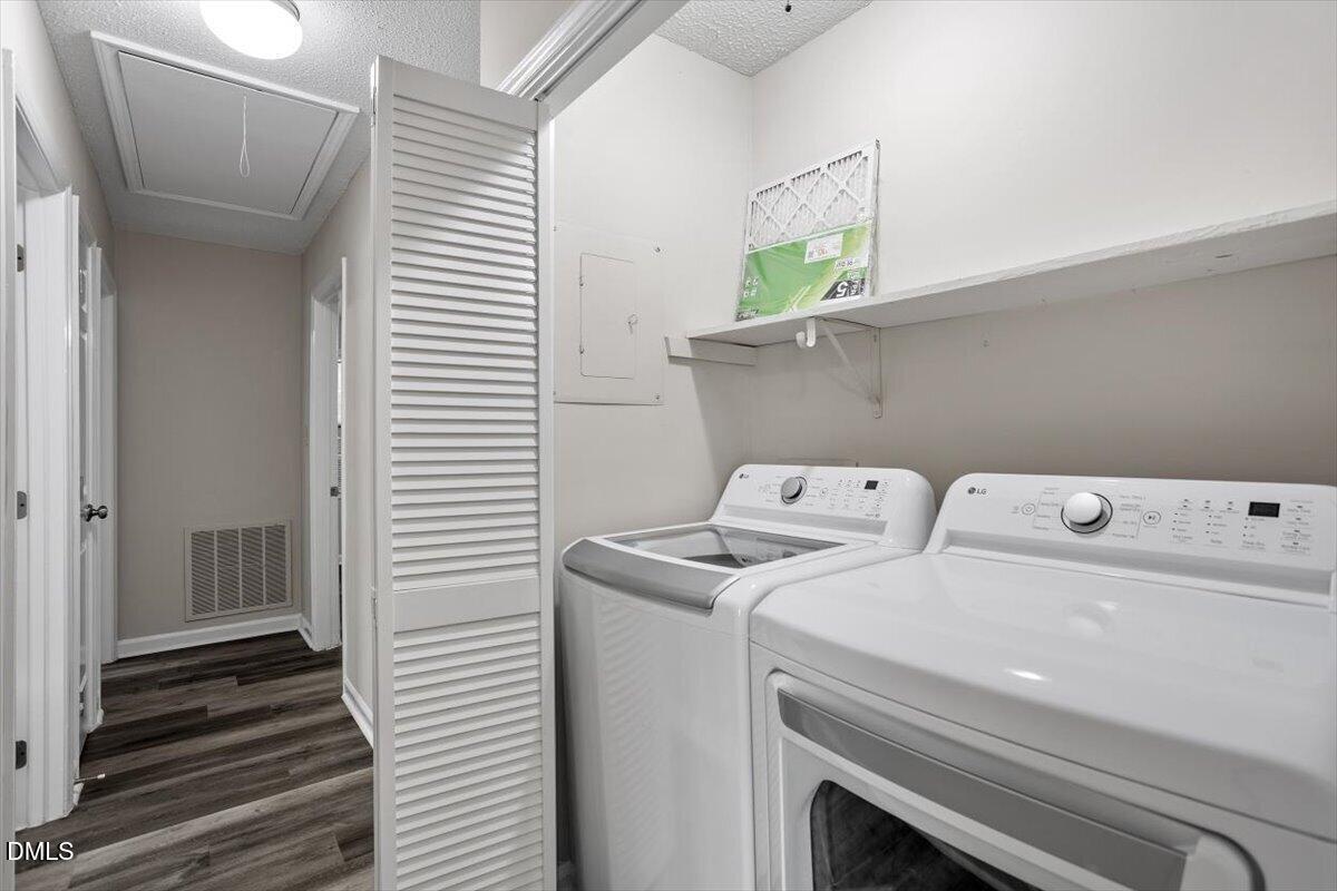 8233 Clear Brook Drive Raleigh, NC 27615 - Photo 15 of 28 a utility room with dryer and washer
