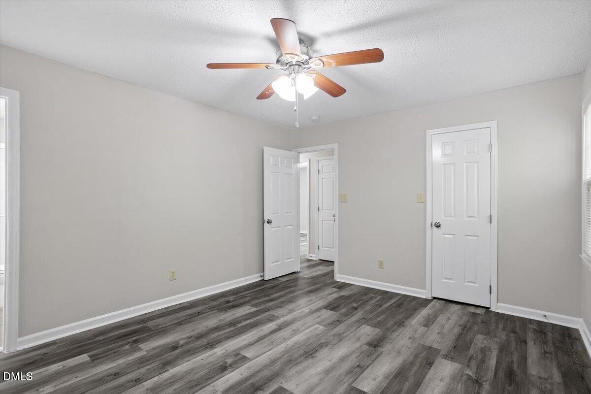 8233 Clear Brook Drive Raleigh, NC 27615 - Photo 18 of 28 wooden floor in an empty room