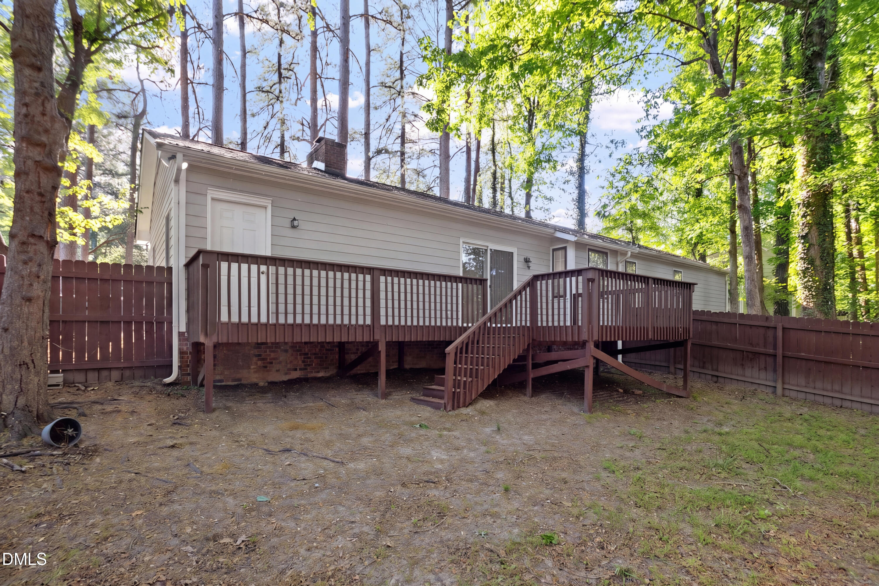 8233 Clear Brook Drive Raleigh, NC 27615 - Photo 27 of 28 a view of backyard with a table and a large trees