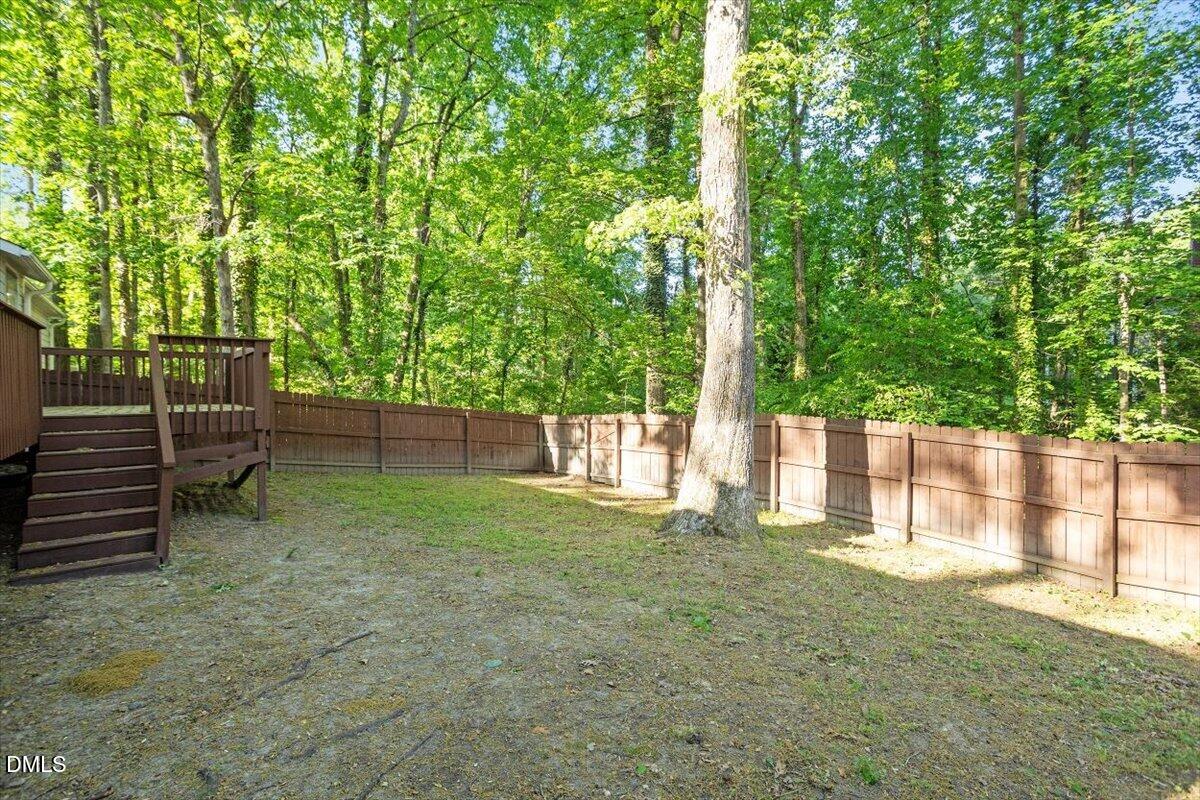 8233 Clear Brook Drive Raleigh, NC 27615 - Photo 28 of 28 a view of backyard with green space