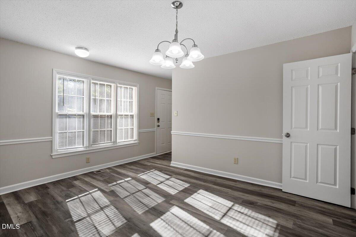 8233 Clear Brook Drive Raleigh, NC 27615 - Photo 6 of 28 a view of an empty room with a window