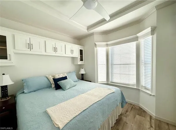 a spacious bedroom with a bed and a walk in closet