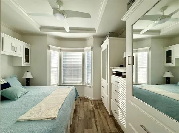 a large white kitchen with cabinets