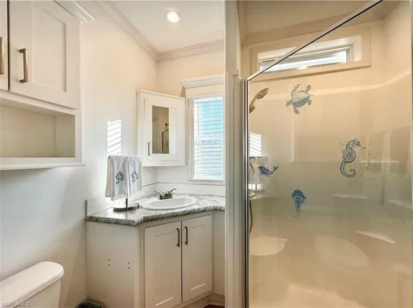 a view of a bedroom with washer and dryer