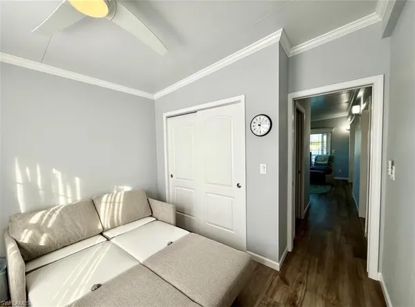 a spacious bathroom with a double vanity sink toilet mirror and tub