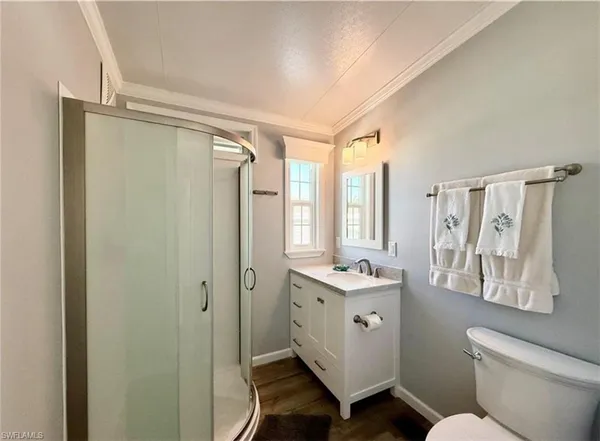 a bathroom with a sink a mirror and a shower