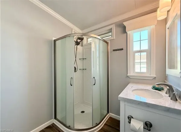 a view of balcony with seating space and hardwood floor