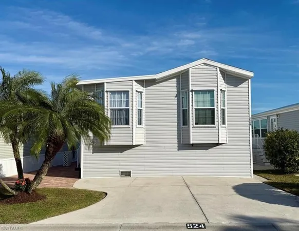 a front view of a house with yard