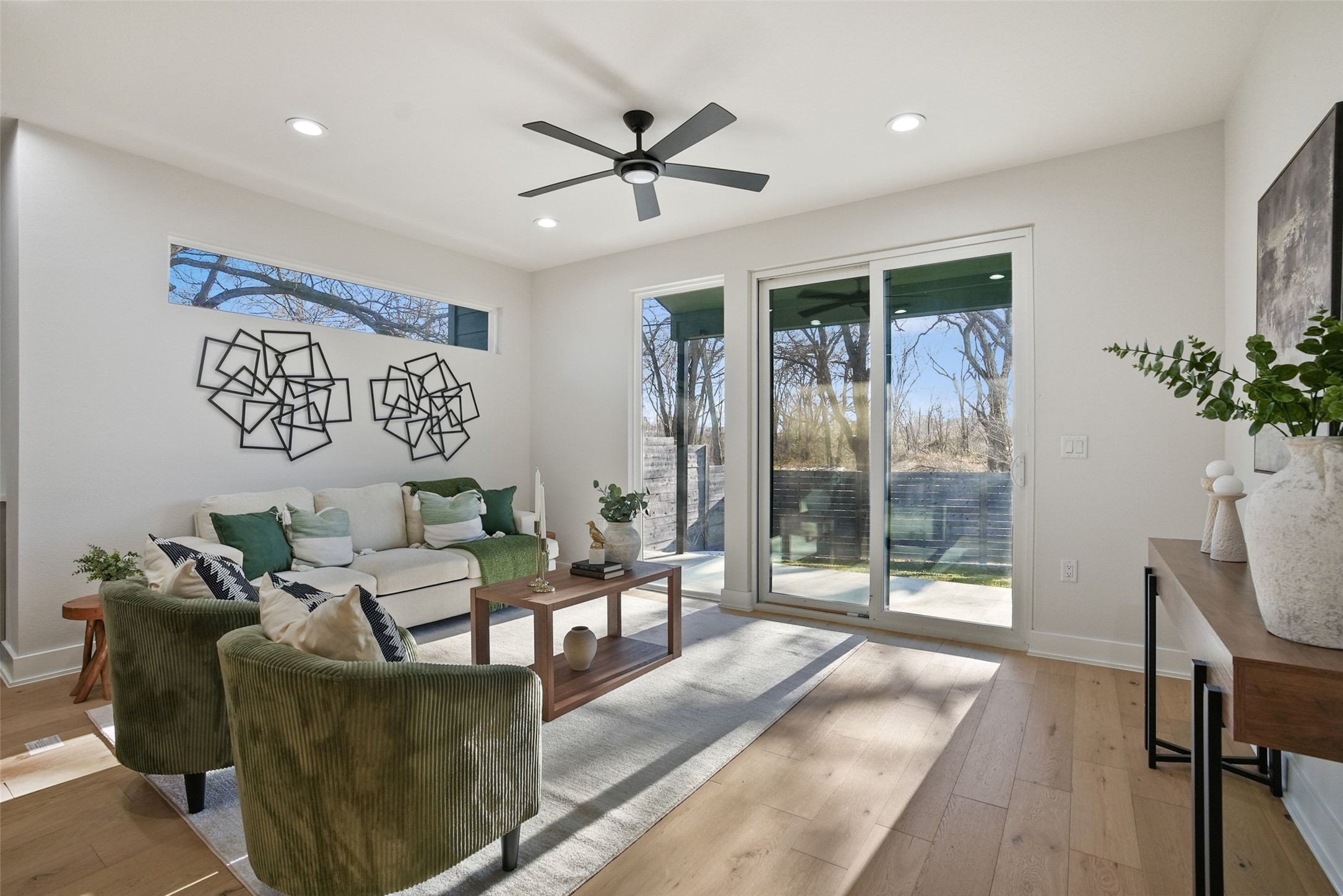 5109 Stone Gate Drive, Unit 2 Austin, TX 78721 - Photo 11 of 36 Spacious living area featuring wood-finish flooring, recessed lighting, and a modern ceiling fan