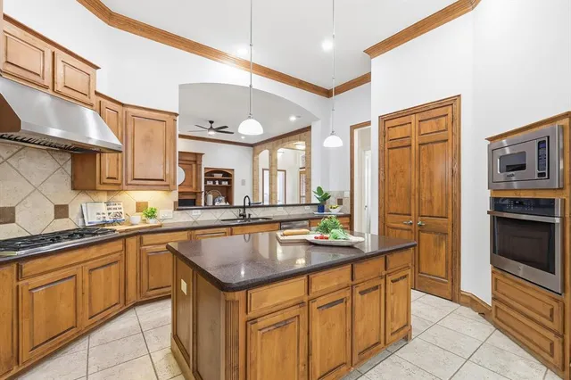 a bedroom with bed couch and window