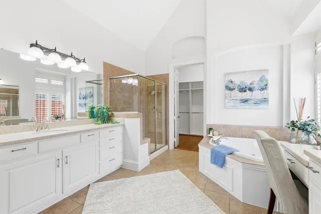 a bathroom with a double vanity sink mirror and toilet
