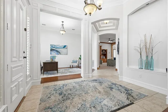 a view of a kitchen area with furniture and chandelier