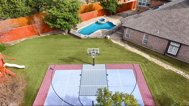 an aerial view of residential houses with outdoor space
