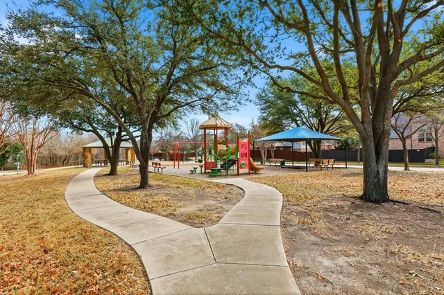 an aerial view of a house with a yard and lake view