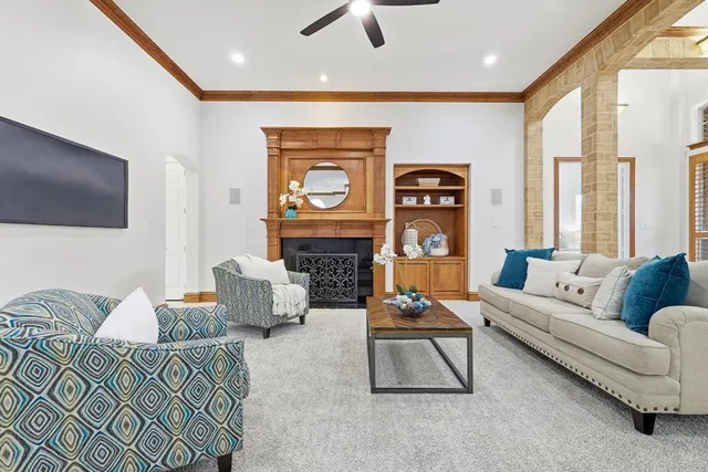 a view of a dining room with furniture a chandelier and wooden floor