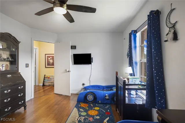 a view of living room with furniture and flat screen tv
