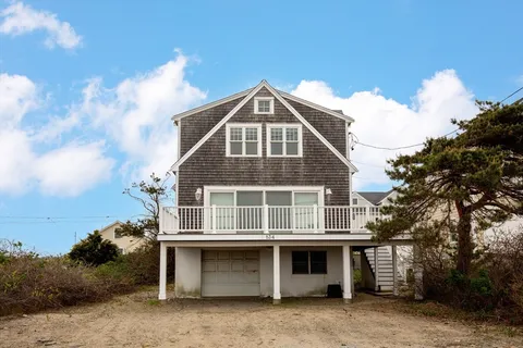 a front view of a house with a garage